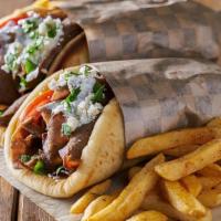 Beef & Lamb Gyro On A Pita Sandwich · Choice of lettuce, tomatoes, onions and tzatziki sauce or hummus. Fries are for picture purp...