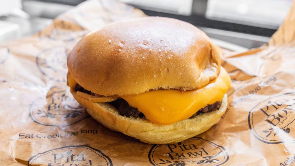 Classic Burger · On a Brioche bread with Classic American Cheese.