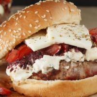 Greek Burger · Greek herbs seasoned with a half pound burger on a French brioche pasted with tzatziki and f...