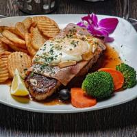 Steak Portuguese Style · Served with ham, fried egg and garlic sauce.