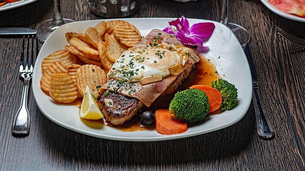 Steak Portuguese Style · Served with ham, fried egg and garlic sauce.