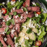 Black & Blue Salad · Certified grass fed hanger steak served on organic mix greens, tomatoes, avocado, carrots, c...
