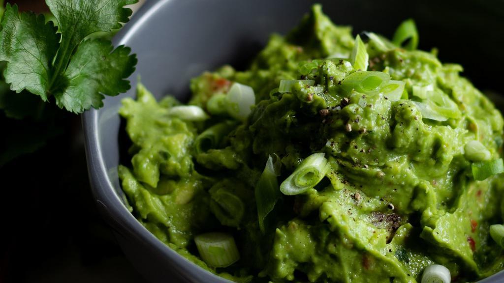 Homemade Guacamole · Traditional fresh guacamole served with tortilla chips.