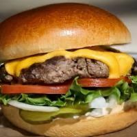 Classic Burger · 8oz Organic Angus beef served with lettuce, tomato, onions, Cheddar cheese and homemade pick...