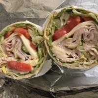 California Wrap · Oven gold turkey, Swiss, sprouts, avocado, lettuce, tomato, and honey dijon dressing with ch...