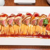 Banzai Roll · Spicy kani and avocado topped with seared tuna and wasabi sauce.