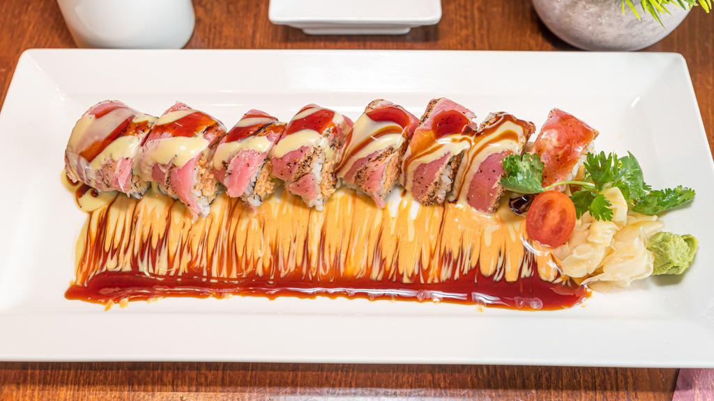 Banzai Roll · Spicy kani and avocado topped with seared tuna and wasabi sauce.