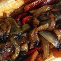 Cheesesteak Hero · Crispy Seitan, peppers & onions with melty cheese on a toasted long roll.