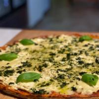 Large White Pizza With Basil Pesto · Freakin' Vegan Ricotta and Mozzarella with Basil-Pesto drizzle...