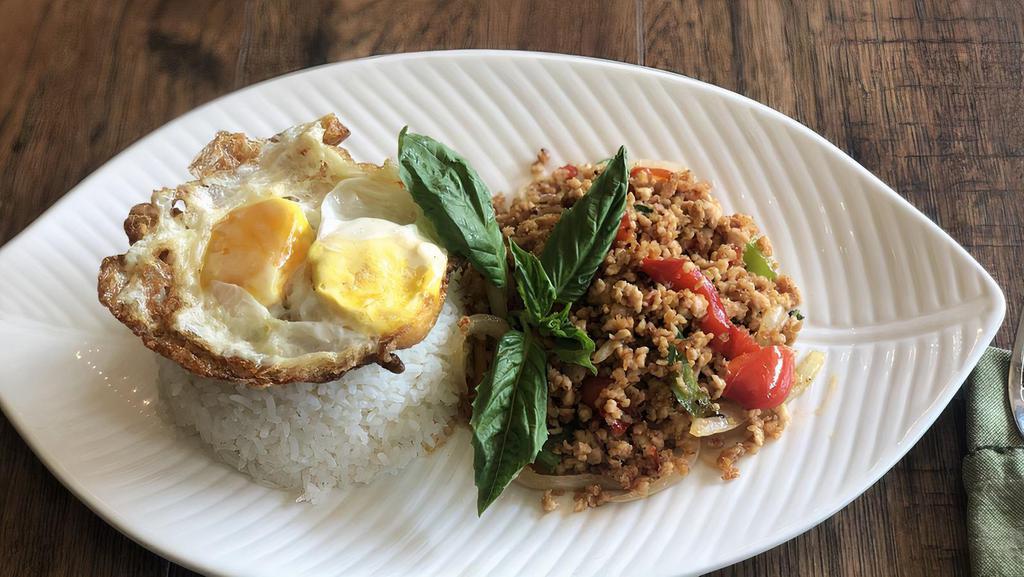 Krapraw Gai Sub · Minced chicken, chili, bell pepper, onion and basil leaves, topped with fried egg served with jasmine white rice.