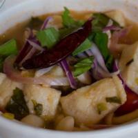 Tom Klong Pla · Gluten-free. Fillet catfish, white mushroom, dry chili, shallot, tomato, basil leaves, culan...