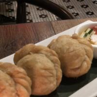 Curry Puffs · Minced chicken, potatoes, onion, and curry powder. Served with sweet cucumber relish.