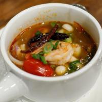 Tom Yum · Gluten-free. Shrimp broth, white mushrooms tomatoes, scallions, and cilantro.