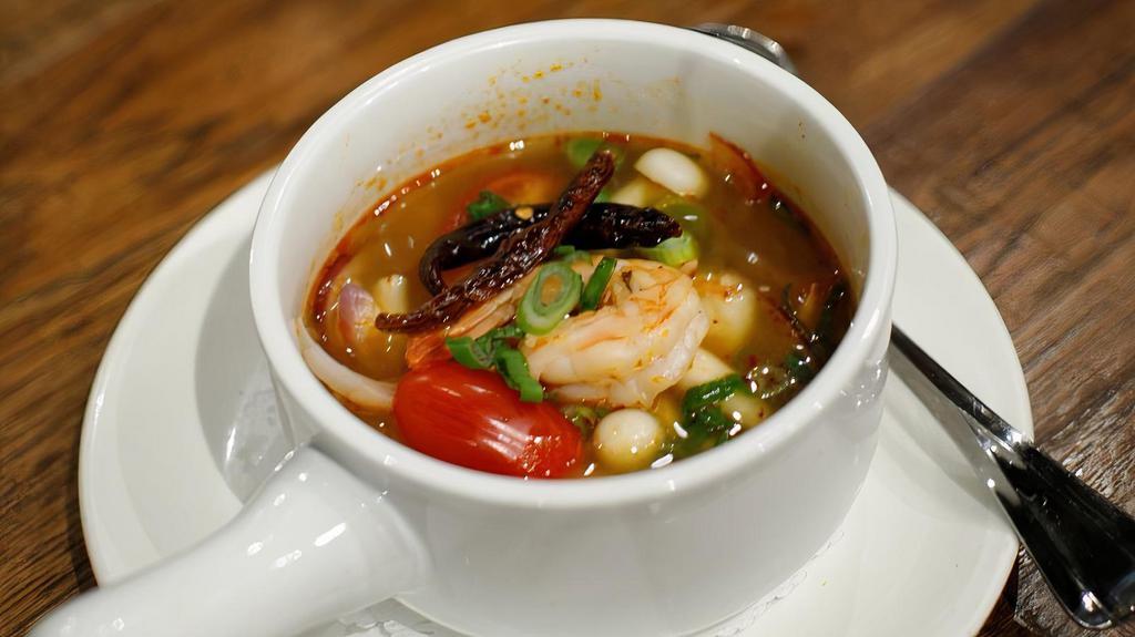 Tom Yum · Gluten-free. Shrimp broth, white mushrooms tomatoes, scallions, and cilantro.