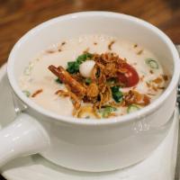 Tom Kha · White mushrooms and scallions in coconut-galangal broth.