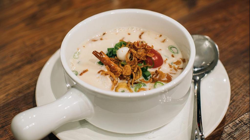 Tom Kha · White mushrooms and scallions in coconut-galangal broth.