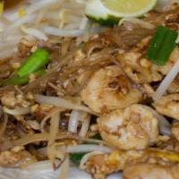 Pad Thai · Gluten-free. Rice noodles, bean sprouts, chopped red onion, scallions, fried egg, and peanuts.