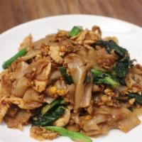 Pad Se-Ew · Broad noodles, Chinese broccoli, and a fried egg with thick soy sauce.