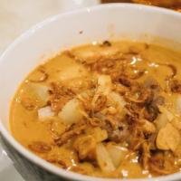 Massamun Curry · Gluten-free. Potatoes, onion and peanuts with coconut milk.