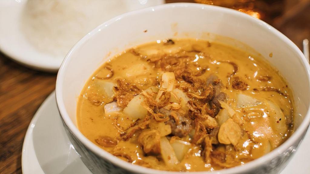 Massamun Curry · Gluten-free. Potatoes, onion and peanuts with coconut milk.