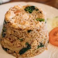 Thai Fried Rice · Chinese broccoli, onion, scallions, tomatoes, and a fried egg mixed with rice.