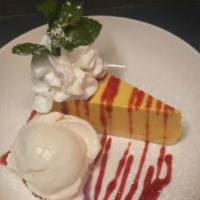 Mango Mousse Cake · served with strawberry sauce and ice-cream.