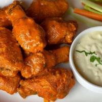 Chicken Wings · Served with spicy buffalo sauce or plain (8 pieces).