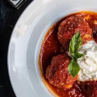Meatballs · Homemade meatballs served with a side of ricotta and marinara sauce.