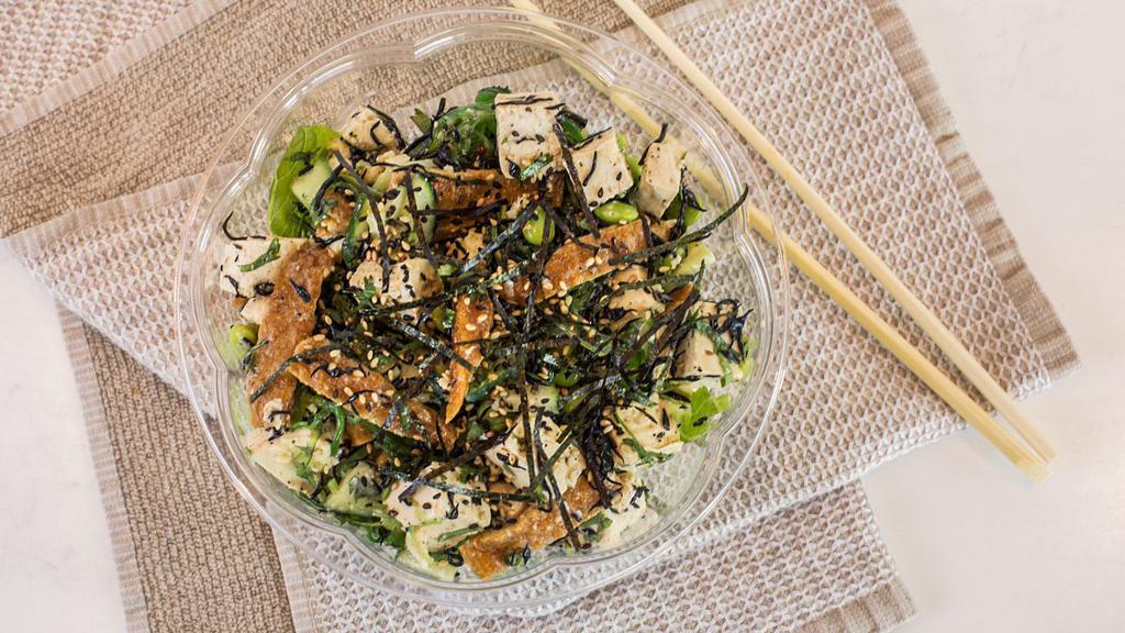 Tofu Poke · Organic Tofu, Seaweed Salad, Hijiki, Edamame, Cucumber, Inari, Cilantro, Sesame, Nori, Sesame Soy Dressing
