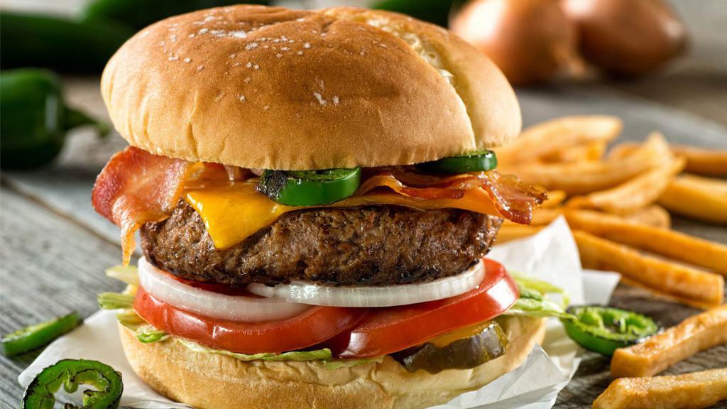 Mexican Burger · Delicious burger prepared with fresh avocado, hot jalapeno, cheddar cheese, chopped tomato, and salsa.