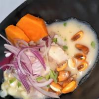 Ceviche Clasico Peruano · Fresh fish, julienne onion, citrus juices, sweet potato, corn and roasted corn.