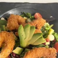 Ensalada Fusion · Panko breaded shrimp, lettuce mix, mango, corn, avocado, cherry tomato, pomegranate, passion...