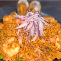 Arroz Con Mariscos Red · Rice with seafood topped with sarsa criolla in a tomato and panca chile base sauce.