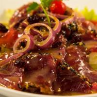 Sesame Seed Tuna Salad · Seared 8 oz. fresh tuna with sesame seeds in wasabi yozu dressing.