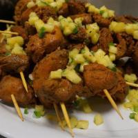 Pinchos (3) · Spiced rubbed chicken kebabs served with a pineapple salsa.