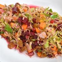 Brussels Salad · Shaved brussels sprouts, golden raisins, pistachios, seasonal squash and beets in lemon vina...