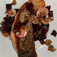Salmon · Served with a red beet buerre blanc, topped with olives,
roasted potatoes & mushroom. Served...