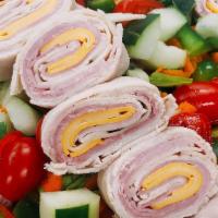 Chef Salad · Romaine lettuce, carrots, cucumber, tomato, red onion, peppers with rolled turkey, ham, Amer...