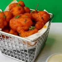 Buffalo Cauliflower Appetizer · Our battered cauliflower (not gluten free) tossed in our house-made buffalo sauce (contains ...