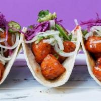 Caulipua Tacos · Mexican street style tacos with asian fusion! battered cauliflower tossed in a house-made se...