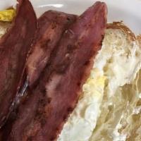 2 Eggs With Turkey Bacon · With choice of side and toast.