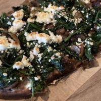Goat Cheese Flatbread · Served with truffle fondue, mushrooms and spinach.