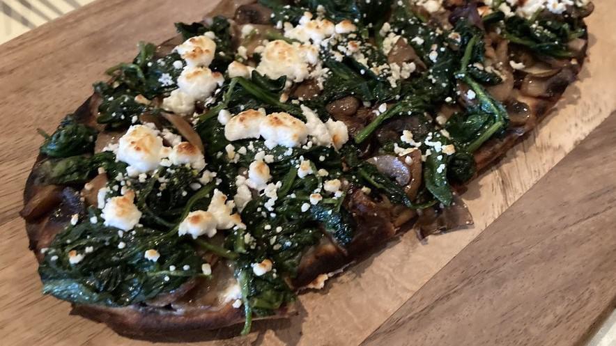 Goat Cheese Flatbread · Served with truffle fondue, mushrooms and spinach.