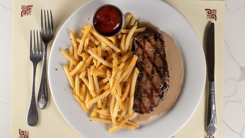 Steak Frites · Grilled ny strip steak with herb butter and french fries. All natural grass fed beef.
