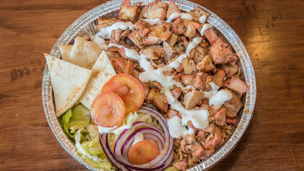 Chicken Over Rice Gyro · Juicy chicken flame-roasted on a vertical rotisserie over rice.