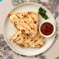 Chicken Quesadilla · Grilled chicken wrapped with cheese in a grilled tortilla.