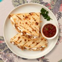 Shrimp Quesadilla · Fresh shrimp wrapped with cheese in a grilled tortilla.