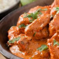 Chicken Curry · Chicken cooked with a base of onion and tomato with fresh ground and whole spices.