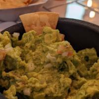 Fresh Guacamole · Hass avocados, chopped white onions cilantro, tomatoes and lime juice.