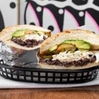 Tortas · Mexican sandwich with black beans, Oaxaca cheese, avocado, tomatoes and jalapenos.